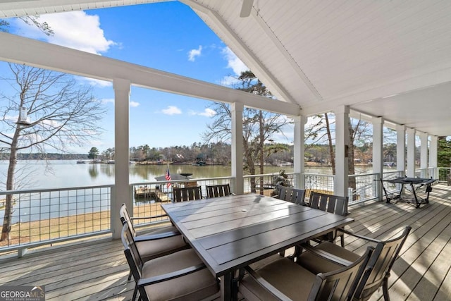 sunroom with a water view and vaulted ceiling