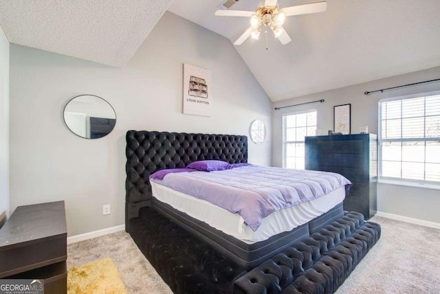 bedroom featuring light carpet, vaulted ceiling, baseboards, and multiple windows