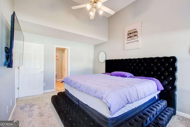 carpeted bedroom with baseboards and connected bathroom