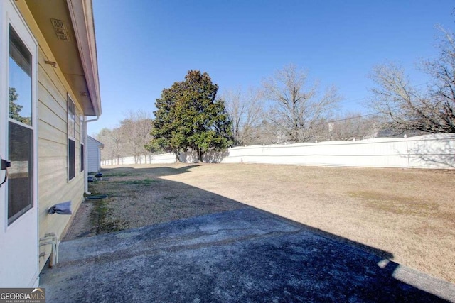 view of yard featuring a fenced backyard