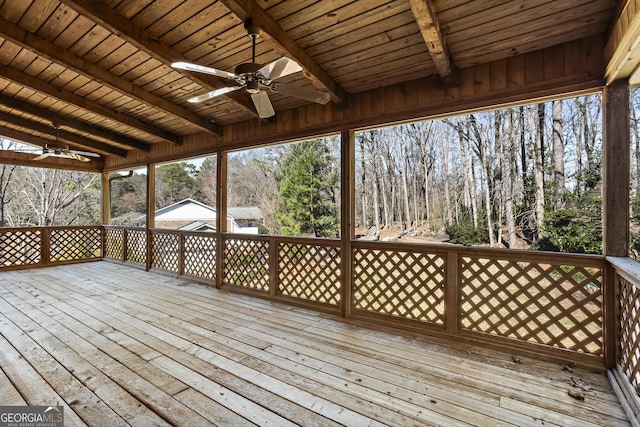 wooden deck with a ceiling fan