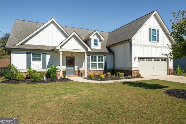view of front facade featuring a front yard, a shingled roof, an attached garage, board and batten siding, and concrete driveway