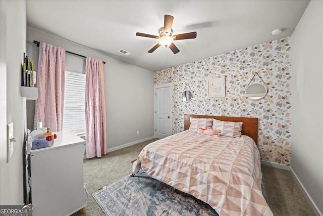 bedroom with wallpapered walls, visible vents, baseboards, and carpet