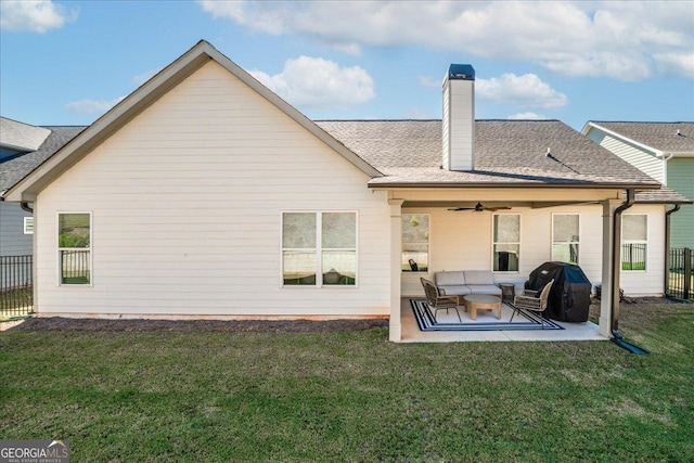 back of house featuring a yard, a patio area, fence, and a ceiling fan