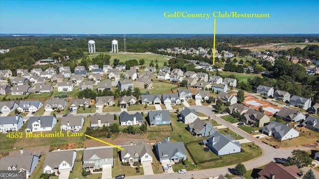 birds eye view of property with a residential view