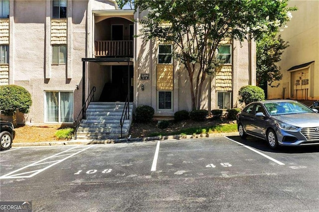 view of property with uncovered parking