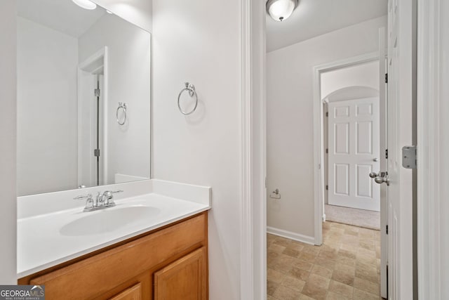 bathroom featuring vanity and baseboards