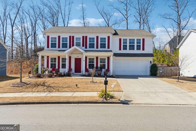 view of front of house with concrete driveway and an attached garage