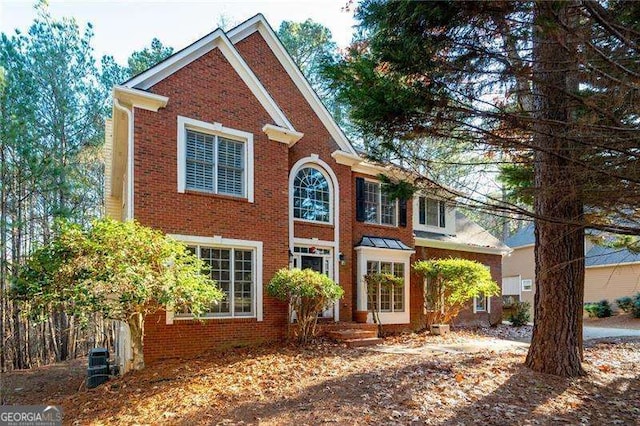 view of front of house featuring brick siding