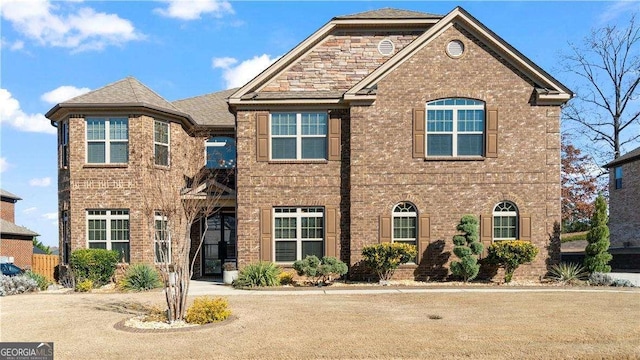 view of front of house with brick siding