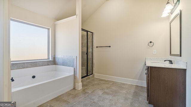 bathroom featuring a bath, a shower stall, vanity, and baseboards