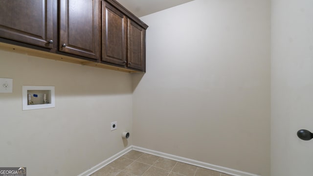 laundry area with baseboards, washer hookup, cabinet space, and electric dryer hookup