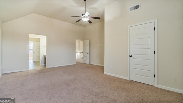 unfurnished bedroom with light carpet, baseboards, visible vents, and connected bathroom