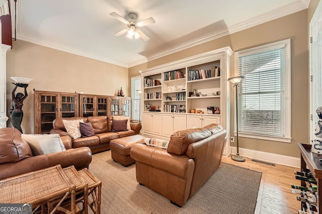 397 4th St NE, Atlanta, GA 30308 - living room with ceiling fan, plenty of natural light, crown molding, and light wood-style floors