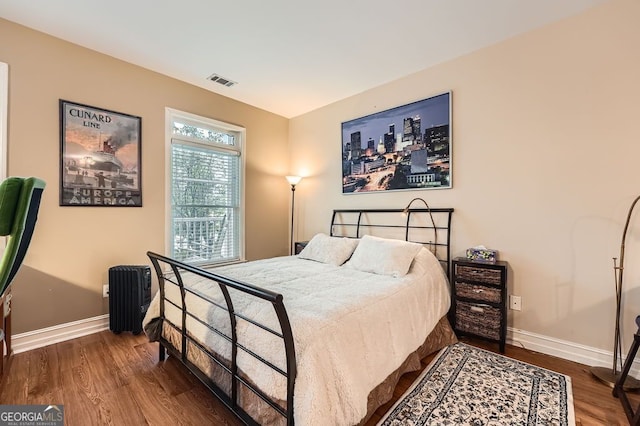 397 4th St NE, Atlanta, GA 30308 - bedroom with wood finished floors and baseboards