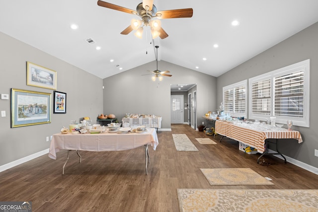 interior space featuring baseboards, visible vents, lofted ceiling, wood finished floors, and recessed lighting