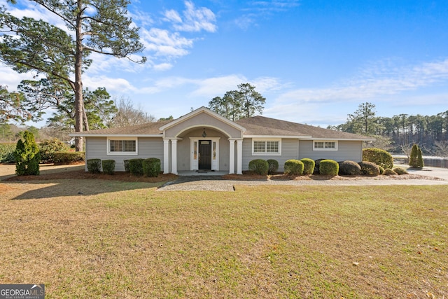 single story home featuring a front yard