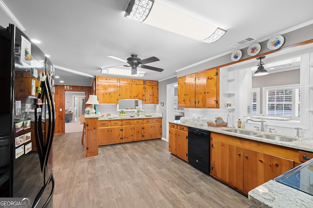 kitchen featuring visible vents, brown cabinetry, black appliances, open shelves, and a sink