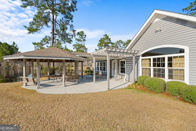 exterior space with a lawn, a patio, a water view, a gazebo, and a pergola