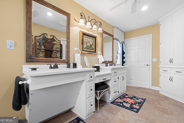 bathroom with recessed lighting, ceiling fan, a sink, and double vanity