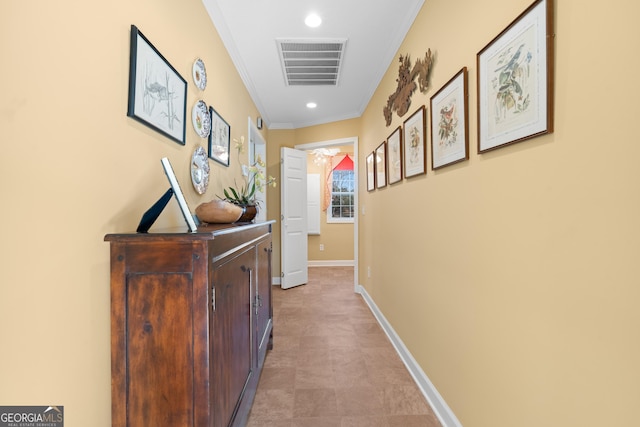 hall with ornamental molding, recessed lighting, visible vents, and baseboards