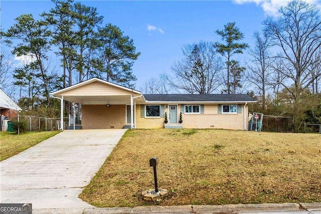 single story home with a carport, fence, a front lawn, and concrete driveway