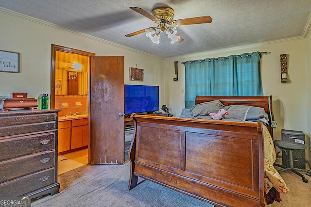 bedroom featuring connected bathroom, ornamental molding, a textured ceiling, and light colored carpet