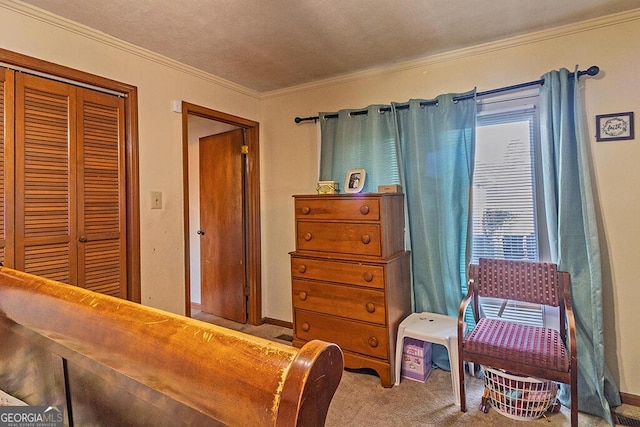 carpeted bedroom featuring a closet and crown molding