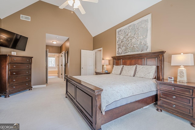 bedroom featuring light carpet, high vaulted ceiling, baseboards, a ceiling fan, and connected bathroom