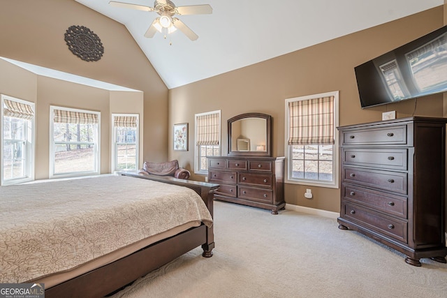 bedroom featuring baseboards, light colored carpet, ceiling fan, and high vaulted ceiling