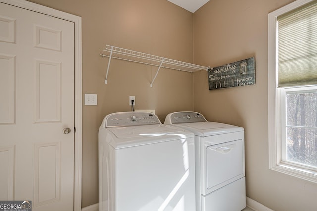 laundry room with washer and dryer and laundry area