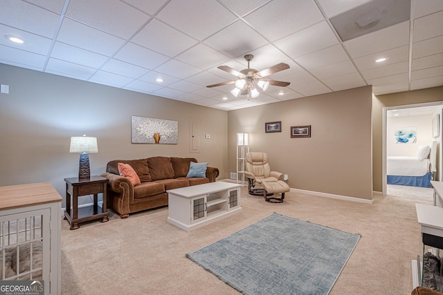 living area with carpet, ceiling fan, a paneled ceiling, baseboards, and recessed lighting