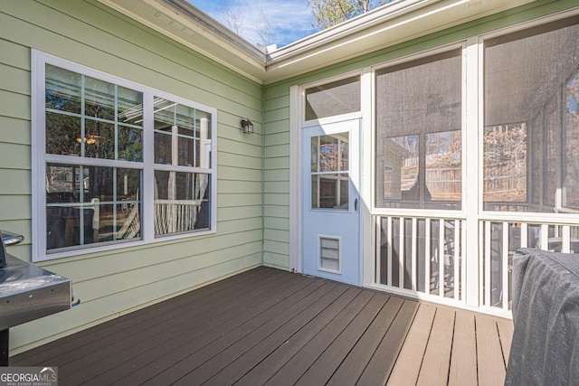 deck with a sunroom