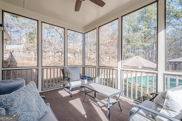 sunroom with a ceiling fan