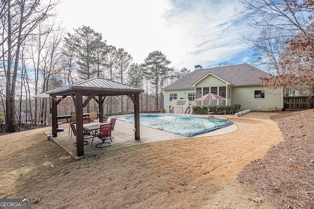 view of pool with a gazebo, stairway, a covered pool, and a patio area