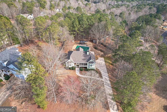 aerial view featuring a view of trees