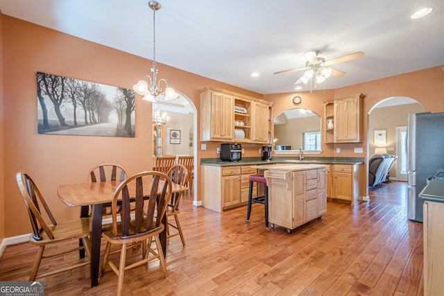 kitchen with light brown cabinets, a ceiling fan, open shelves, a center island, and recessed lighting