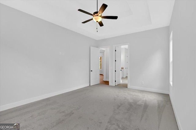 unfurnished bedroom with carpet, baseboards, and ceiling fan