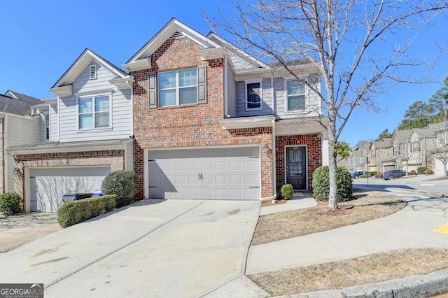 view of front facade featuring driveway, brick siding, and an attached garage