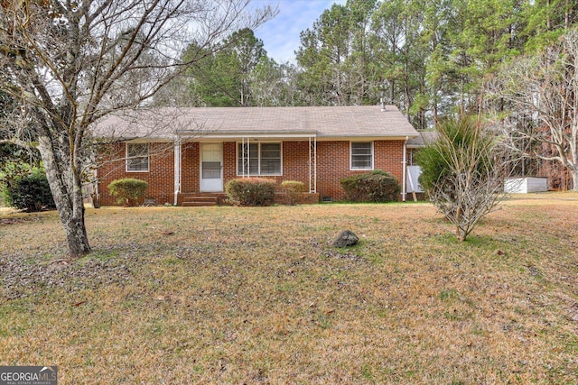 ranch-style house featuring crawl space, brick siding, and a front lawn