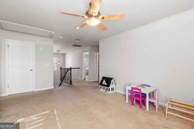 game room featuring attic access, light colored carpet, visible vents, and baseboards