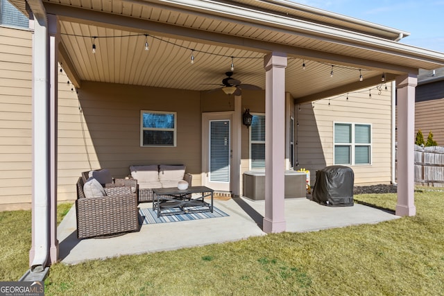 view of patio with ceiling fan, fence, and an outdoor living space