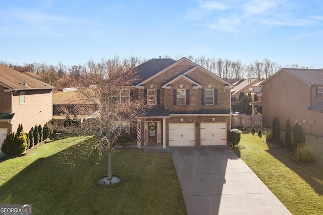 view of front facade with a garage, a front yard, concrete driveway, and brick siding