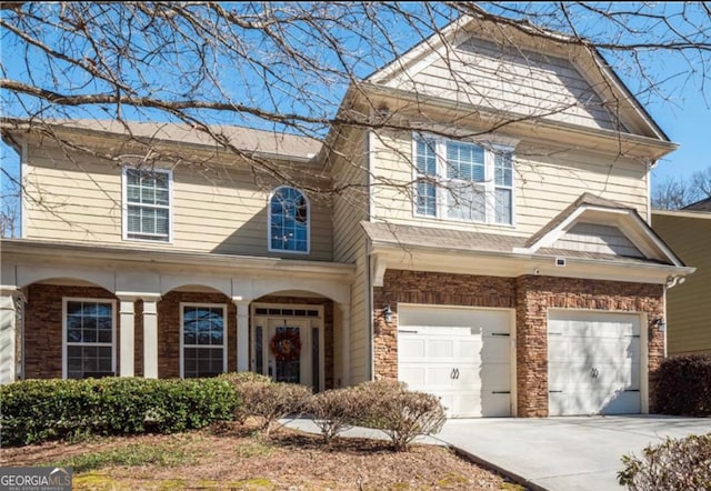 view of front of home featuring driveway and an attached garage