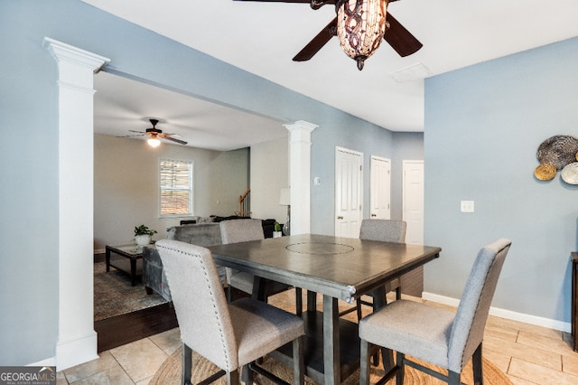 dining room with decorative columns, baseboards, and ceiling fan