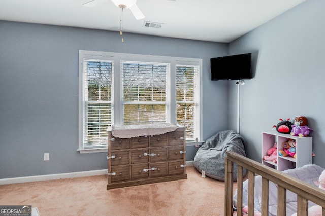 bedroom with light colored carpet, multiple windows, visible vents, and baseboards