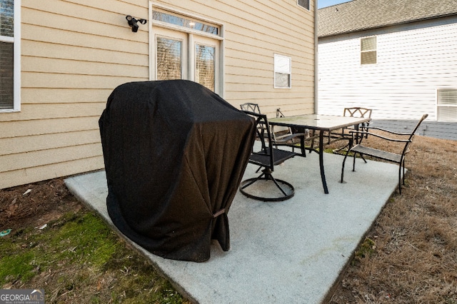 view of patio featuring area for grilling and outdoor dining space