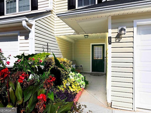 view of exterior entry featuring covered porch