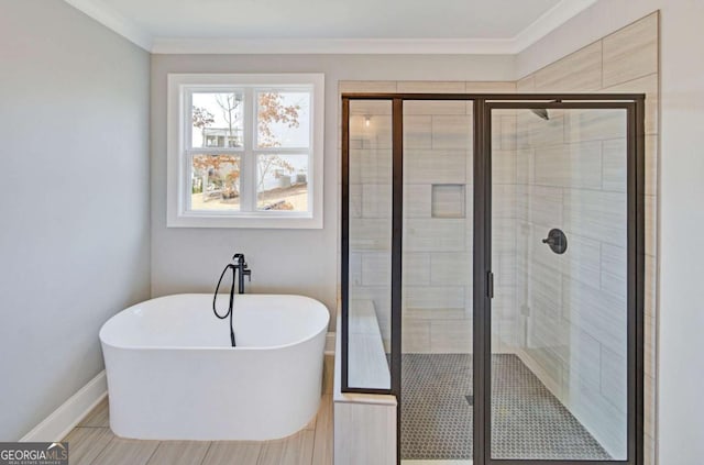 107 Bob White Dr, Calhoun, GA 30701 - full bath featuring a freestanding tub, a shower stall, and ornamental molding