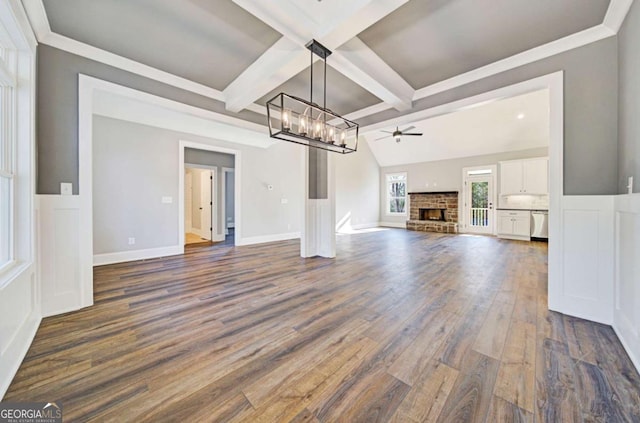 107 Bob White Dr, Calhoun, GA 30701 - unfurnished living room featuring a chandelier, dark wood-style floors, a brick fireplace, coffered ceiling, and beamed ceiling